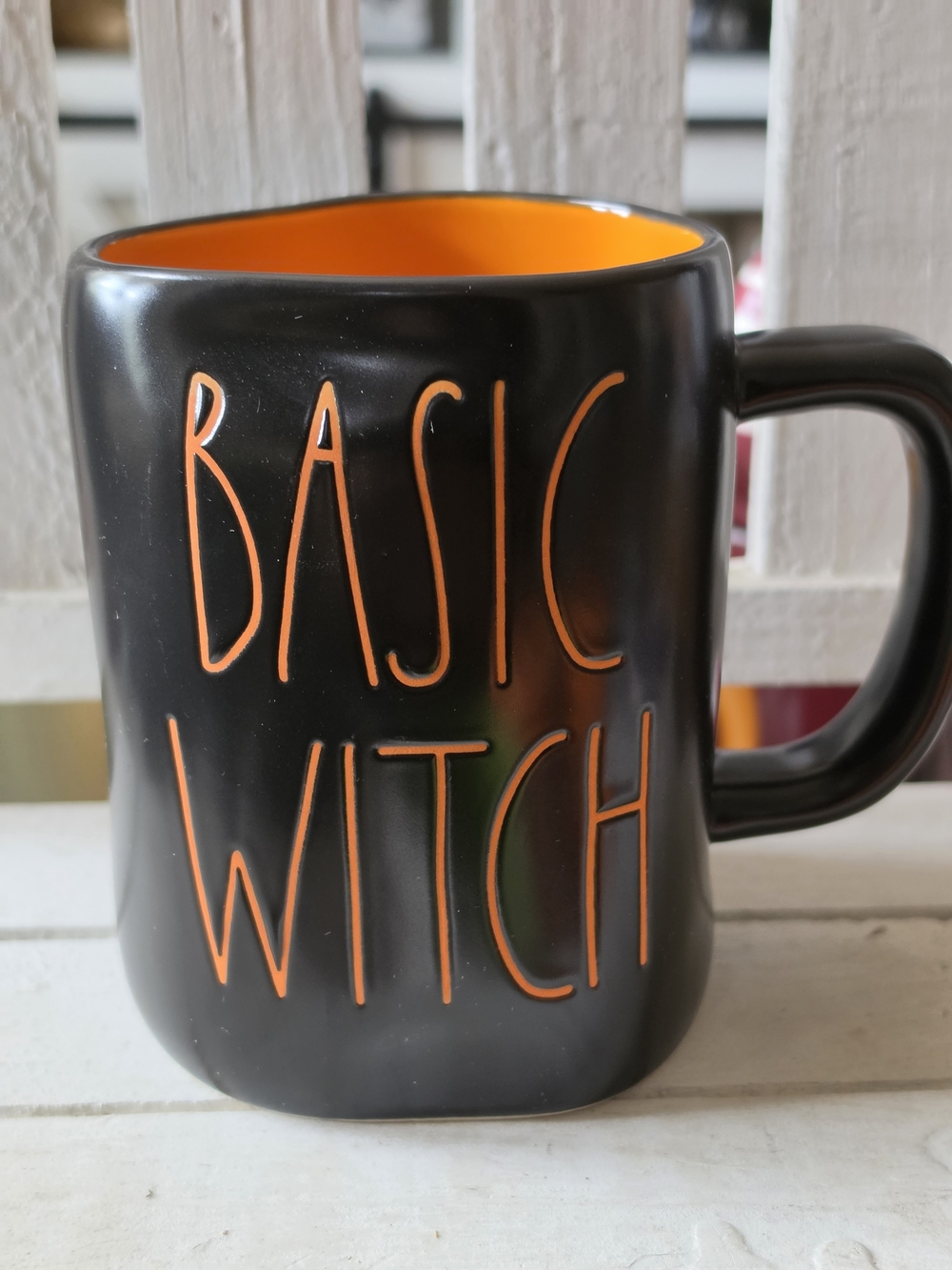 Rae Dunn Black Ceramic Mug with Orange Interior & Lettering